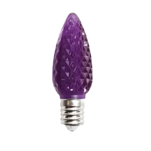 Faceted purple C7 Minleon bulb close-up on black background