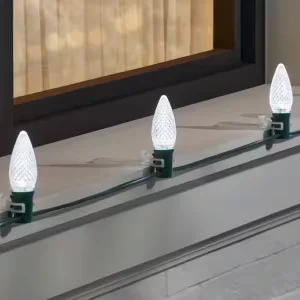 Cool white faceted C9 bulbs arranged in a 25-count pack