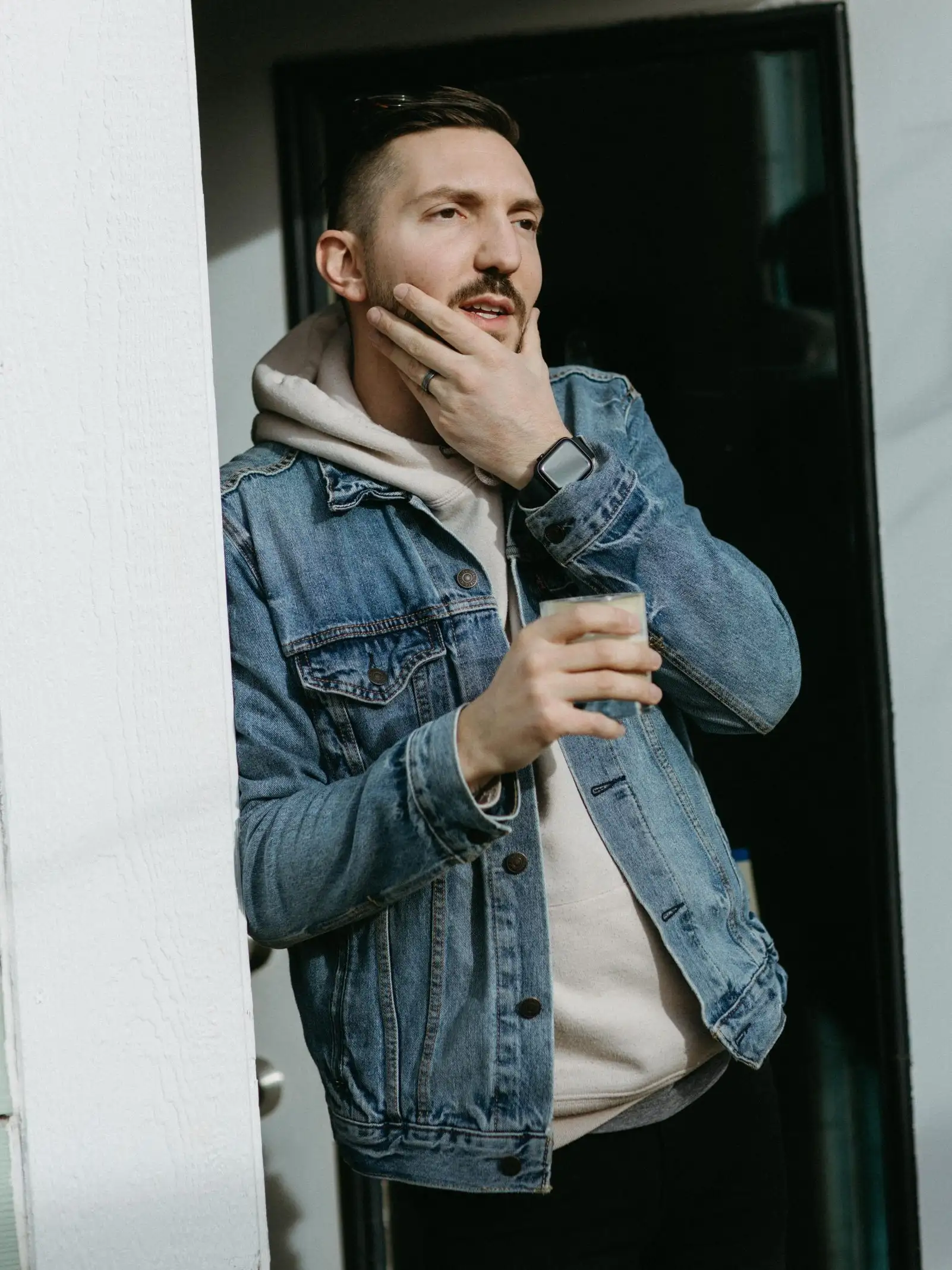 Jake leaning in a doorway