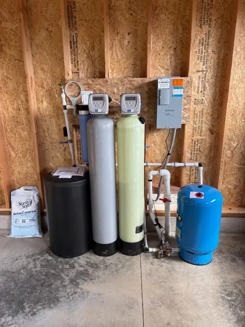 Water softener, filtration tanks, and pressure tank installed by Star Water Systems